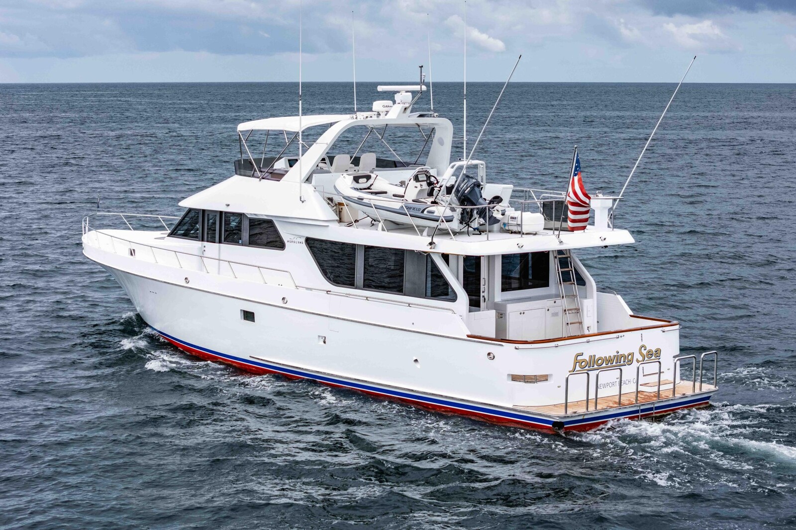 Stern quarter view of the Nordlund 74 Following Sea II showing flybridge and boat deck