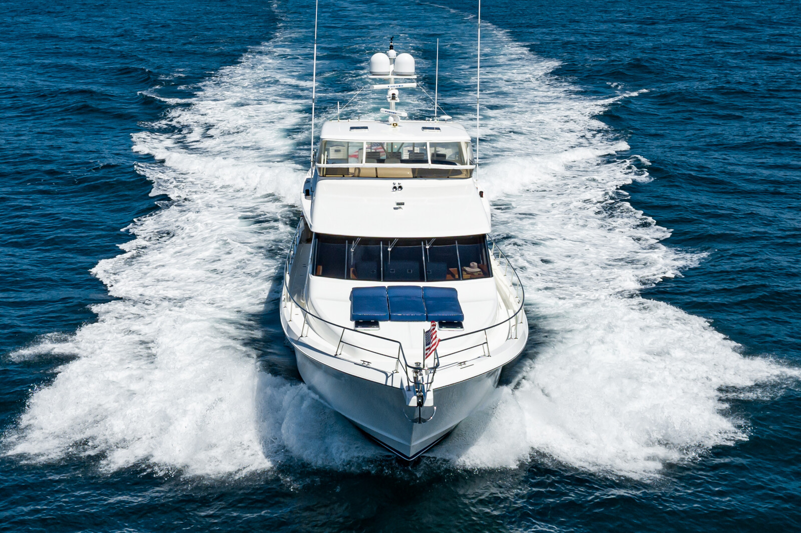 Bow of the West Bay SonShip 78 Mahana cutting through Pacific water, listed with Fraser Yachts San Diego